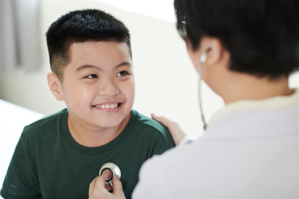 boy-talking-to-doctor-during-medical-exam