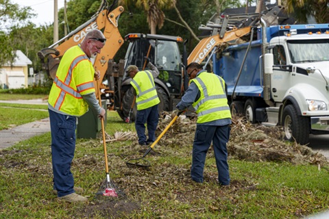 Photo of City of Kissimmee staff collecting debris following Hurricane Milton. 